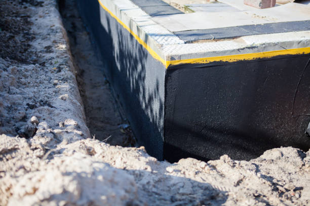 Professional Waterproofing technician working in Ixonia, WI